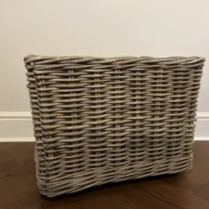 Wheeled natural Rattan log basket with a hessian lining side view